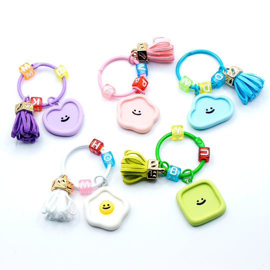 Llavero con cara sonriente